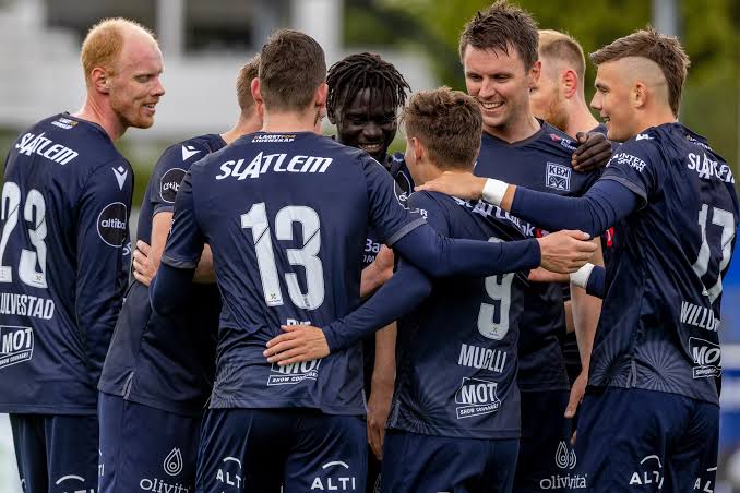 KBK players in a huddle before kick-off